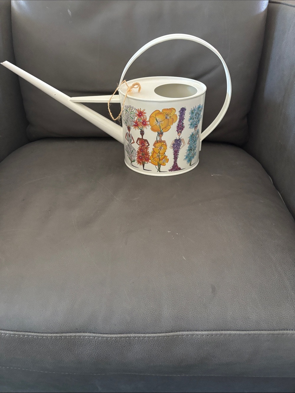 Whimsical White Floral Decorative Watering Can with Colorful Bloom Figures